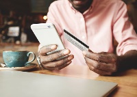 image of man using phone to bank