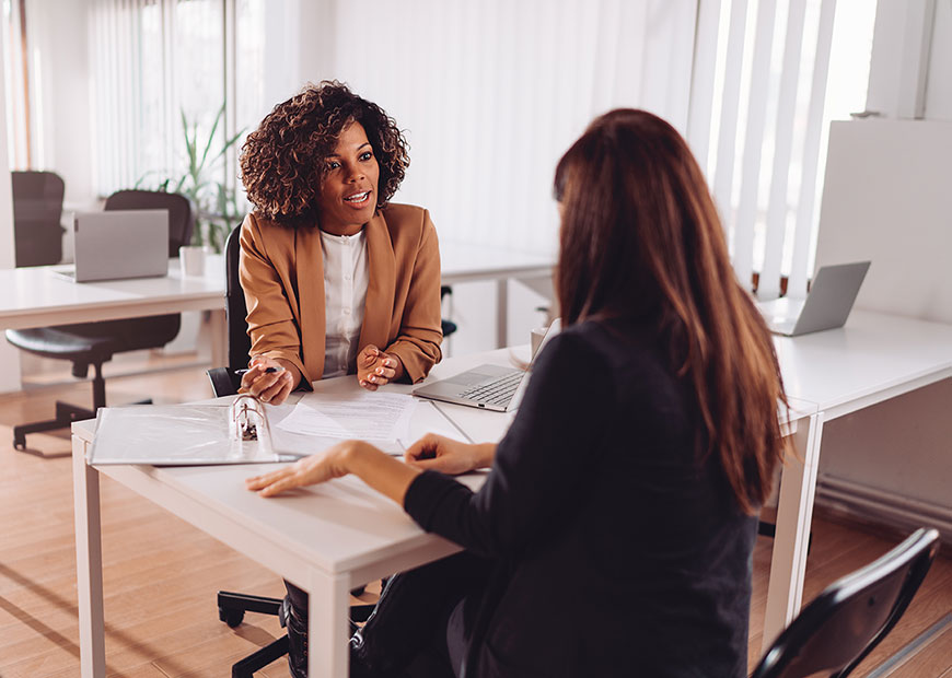 image of woman meeting with female advisor
