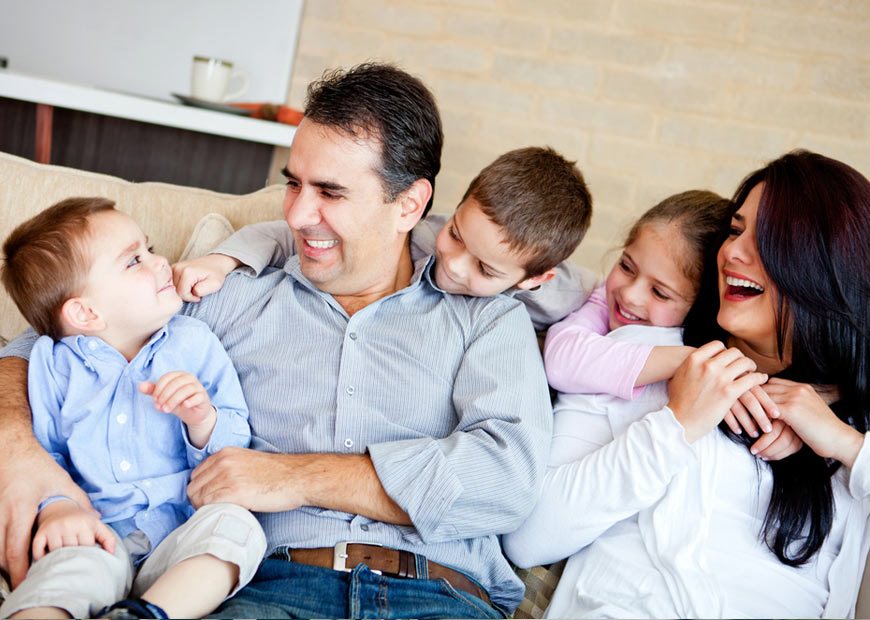 image of happy family with three young kids