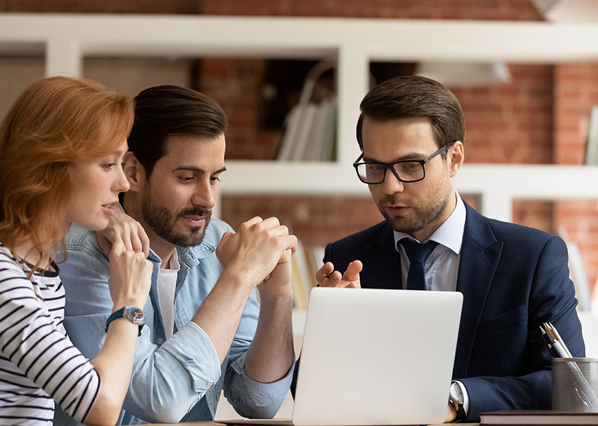 image of couple meeting with an advisor