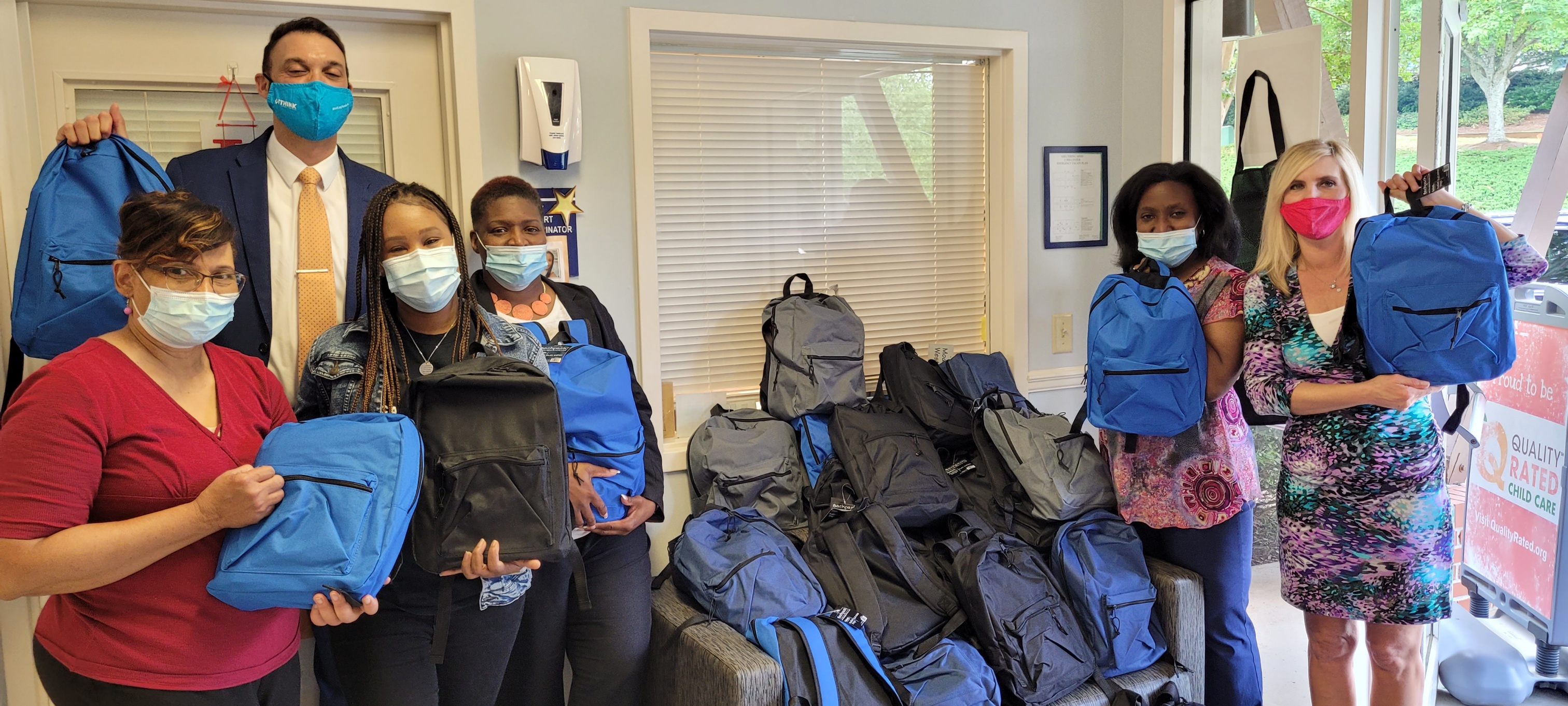SRD_2021_1 image of School Ready Day event with employees and backpacks