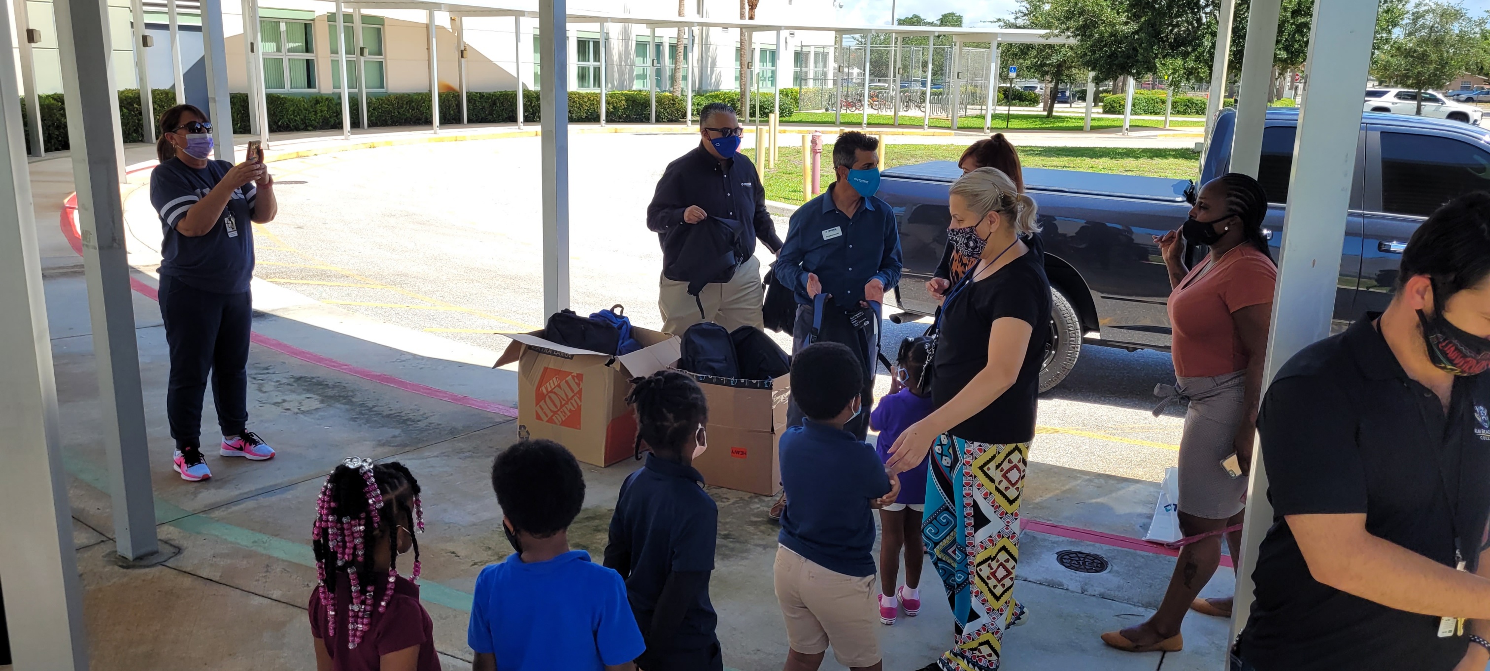 image of School Ready Day event with kids getting backpacks